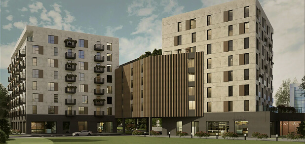 Szeroka wizualizacja architektoniczna kompleksu mieszkalnego Capital Towers Residence w Rzeszowie. Widoczne są dwa główne, jasnoszare budynki wielorodzinne o nowoczesnej, geometrycznej bryle z ciemnymi wnękami okiennymi. Obie części połączone są charakterystyczną, wiszącą przewiązką o brązowej elewacji z pionowymi lamelami, pod którą przebiega droga. Na parterze znajdują się przeszklone lokale usługowe, przed którymi rozciąga się zielony trawnik, równe chodniki oraz biały samochód na podjeździe pod lekko zachmurzonym niebem.
