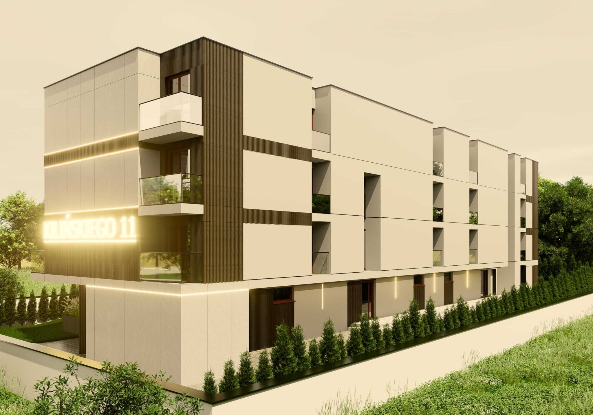 Wizualizacja bocznej i tylnej elewacji budynku apartamentowego „Kilińskiego 11” ukazana z perspektywy parteru. Konstrukcja charakteryzuje się nowoczesną, geometryczną formą z przewagą gładkich, jasnych paneli ściennych oraz pionowych wstawek z ciemnego drewna. Na bocznej ścianie widoczny jest fragment świecącego napisu z nazwą inwestycji. Wzdłuż całego budynku, przy betonowym murku, posadzono gęsty szpaler małych, zielonych iglaków, oddzielających obiekt od sąsiadującej łąki.